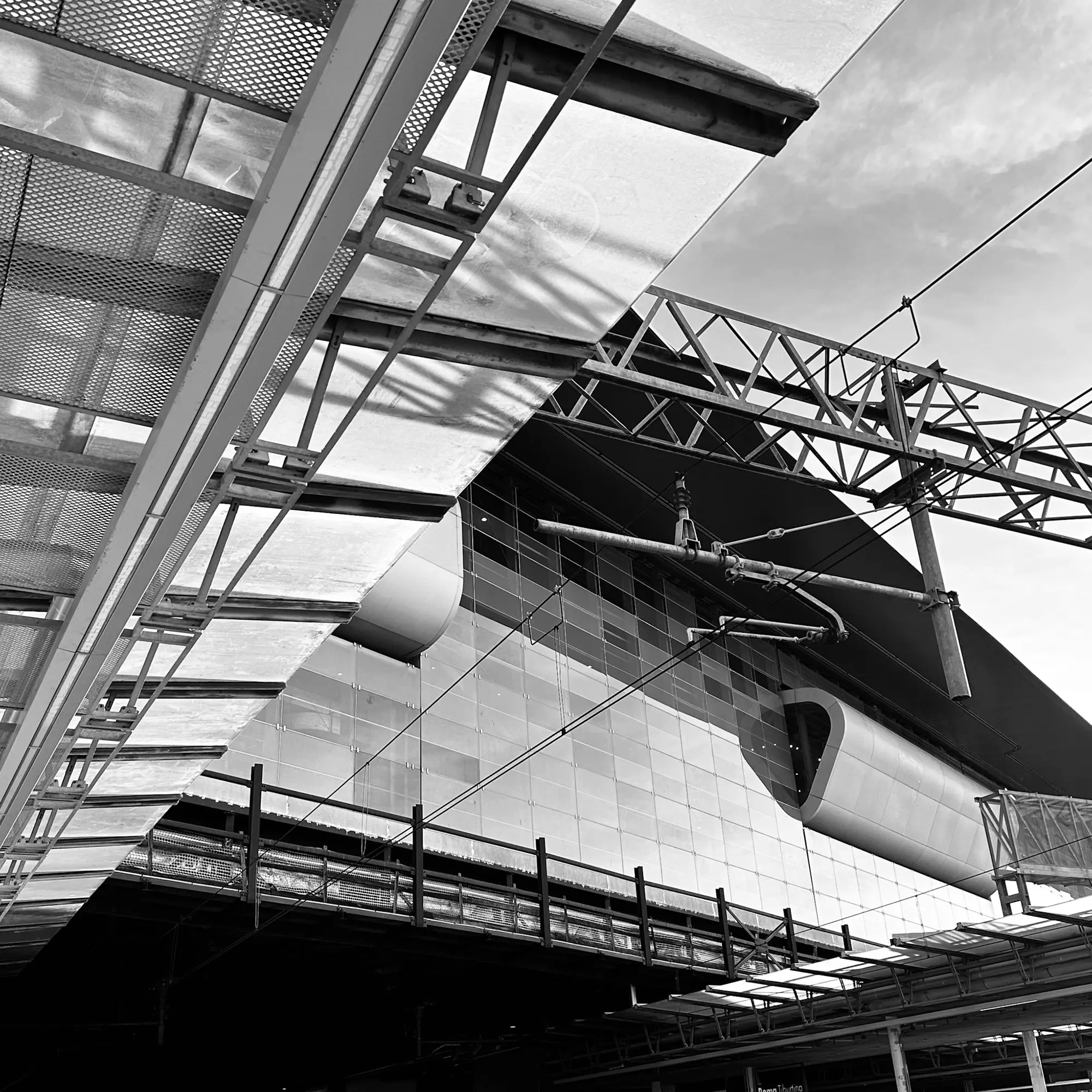 A digital photograph of train station architecture at Roma Tiburtina in Roma, Italia. 