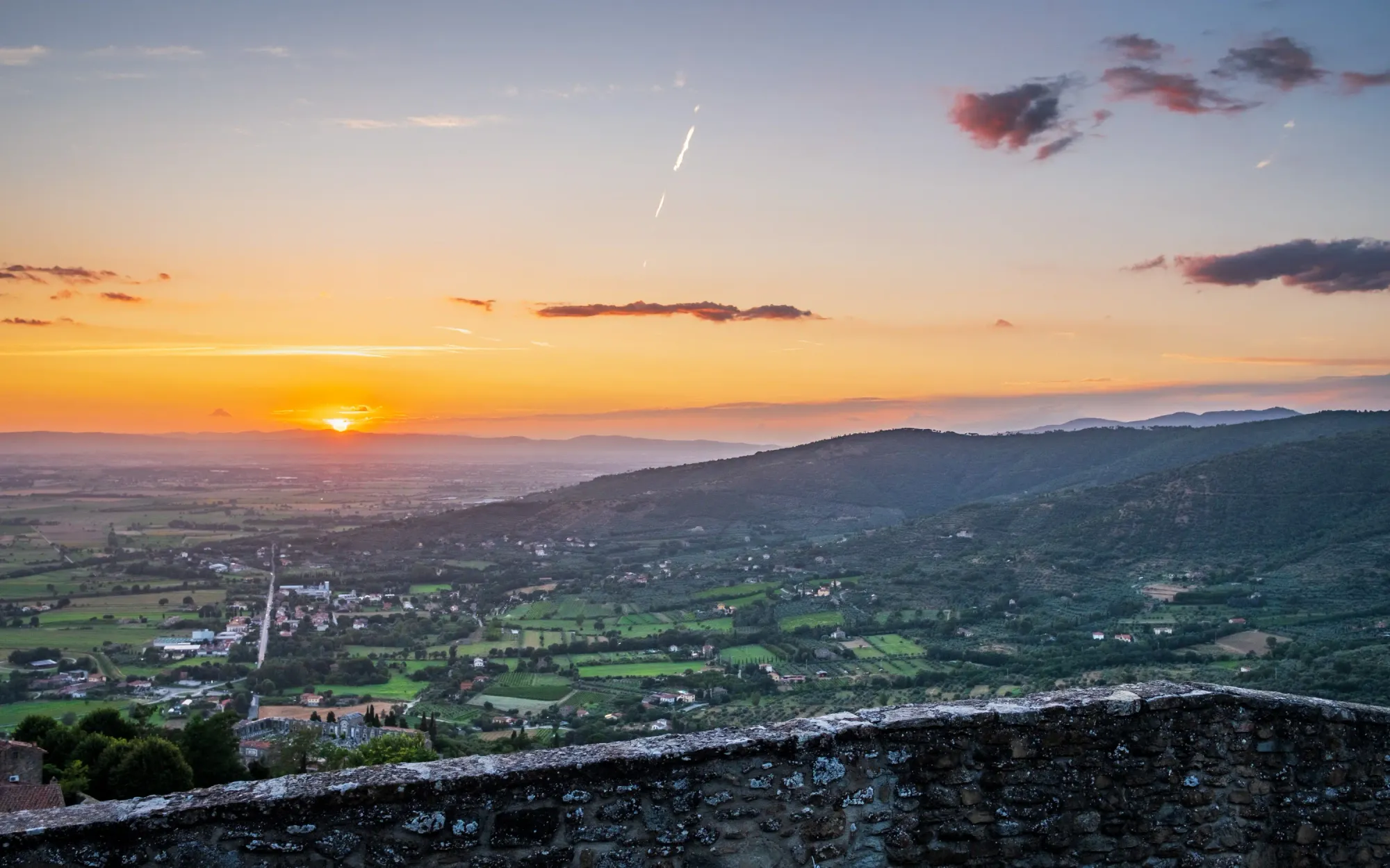Sunset over Cortona, Italia and its cemetery on July 25, 2023.