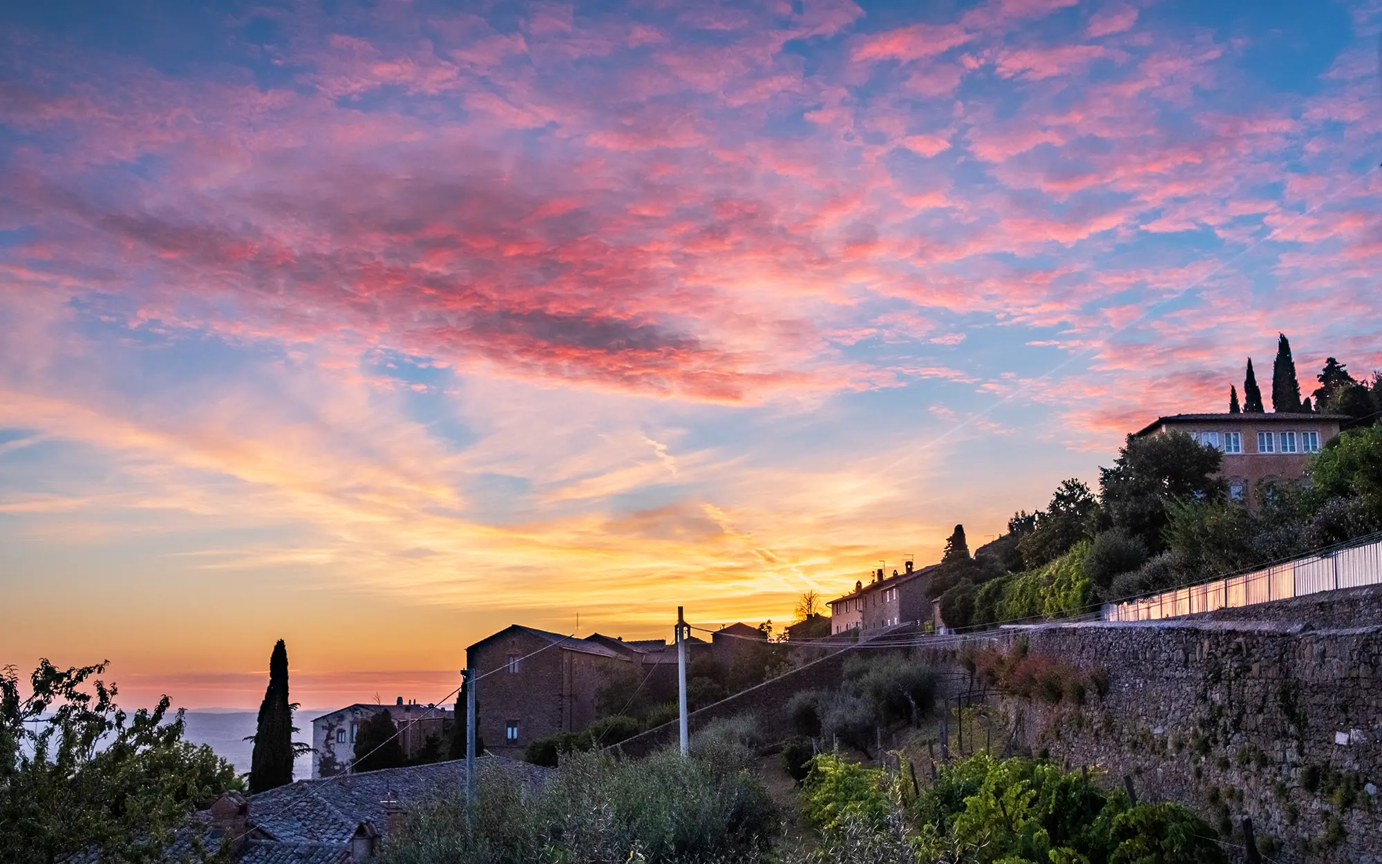 Digital landscape photograph of sunset over the UGA Cortona campus in Cortona, Italia.