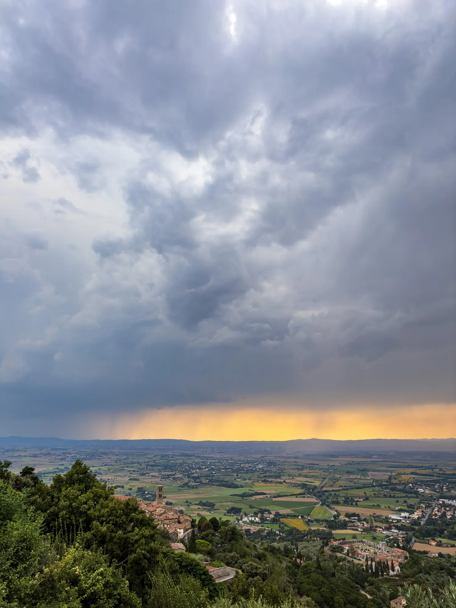 Digital landscape photograph of a thunderstorm approaching Cortona in Toscana, Italia.